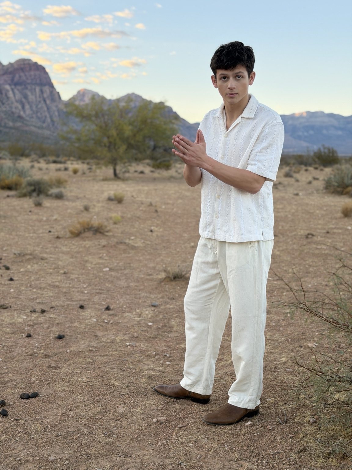 Donnie in a white outfit in the desert